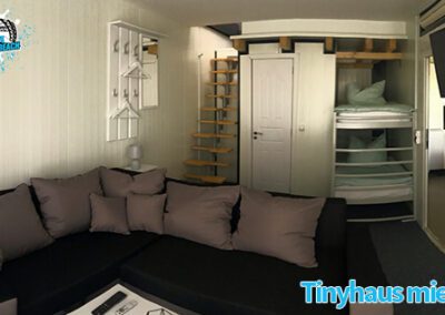 Tinyhaus von innen mit großer Couch und Betten